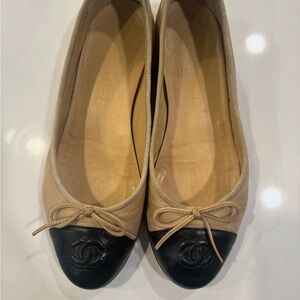 Beige and black CHANEL ballet flats